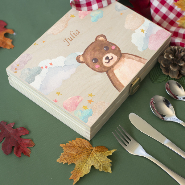 Cutlery engraved with clouds and animals
