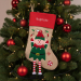 Christmas stocking with embroidered name and Christmas figurines Christmas stocking with embroidered name and Christmas figurines