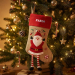 Christmas stocking with embroidered name and Christmas figurines Christmas stocking with embroidered name and Christmas figurines