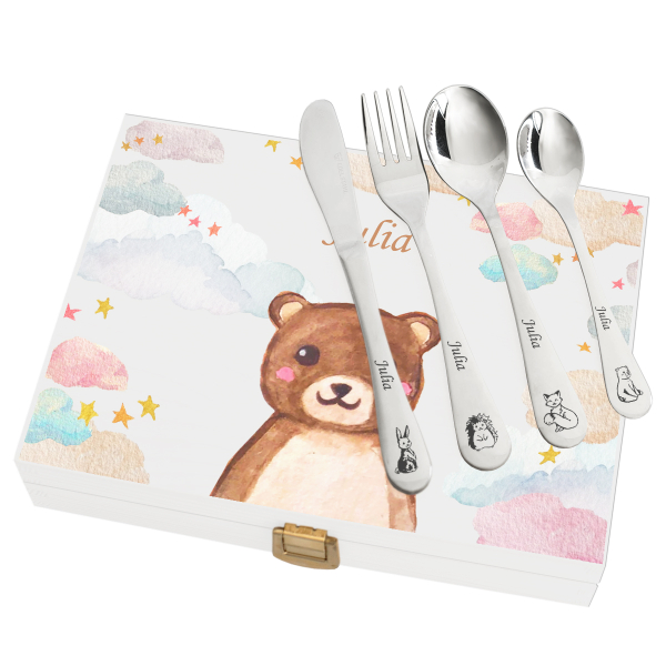 Cutlery engraved with clouds and animals