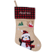 Personalised beige Christmas stocking with tartan pattern